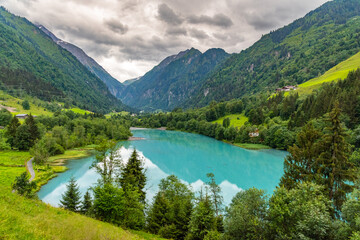 Naklejka na ściany i meble Klamsee - mountain water reservoir above Kaprun town with bright turquoise blue water, Austria