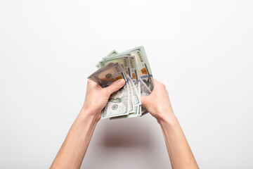 Female hands hold, counts money, dollars on a light background. Concept of pay, wealth, purchase,...