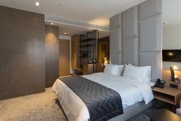 Fototapeta na wymiar Interior of a luxury master bed hotel bedroom