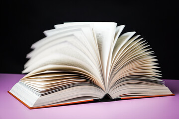 Open book on the table. It is time for education and therefore you need to go back to school.