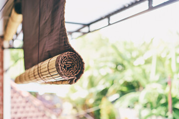 A photo focusing on bamboo blinds.