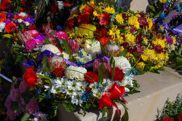 Beautiful colorful fresh floral  wreaths  for Anzac Day memorial celebrations  25th April in Bunbury ,Western Australia to honor and remember those who gave their lives in battles "lest we forget."
