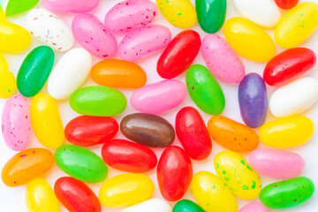 Colorful candies on a white background as colored background