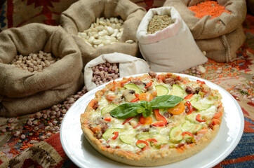 pizza in front of legume family sacks