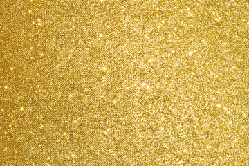 sparkles of golden glitter texture background
