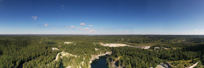 panoramic view of the green lake in the mountains in the canyon filmed from a drone