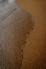 The bubble wave on the sand.