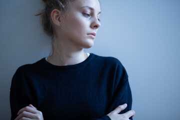 Portrait of young sad woman with anxiety disorder, anorexia ans loneliness concept
