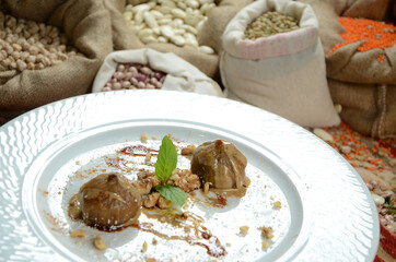turkish traditional dessert in front of legume family sacks