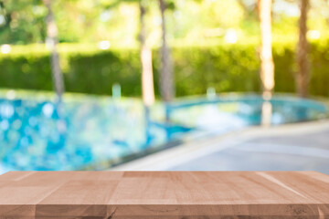 Product show On a brown wooden table Outdoor swimming pool area