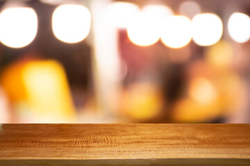 Product display on brown wooden table Bokeh background from the bulb shop