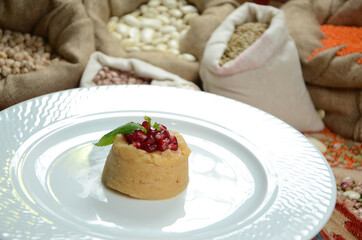 turkish traditional dessert in front of legume family sacks