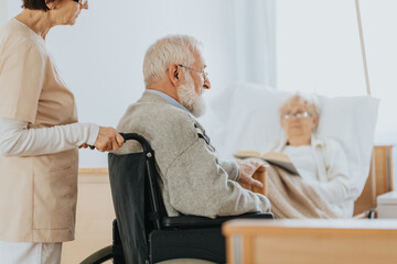 Obraz premium Senior man after stroke sits in a wheelchair at a nursing home
