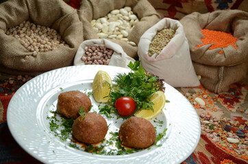 traditional turkish ottoman food in front of legume family sacks