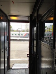 View of the platform from the passenger train vestibule