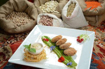 traditional turkish ottoman food in front of legume family sacks