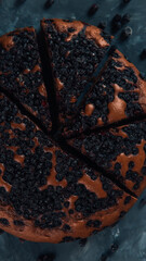 Blueberry pie with berries, homemade fresh pastries, on a stone background. Copy space.