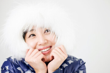 young woman wearing parka, close up