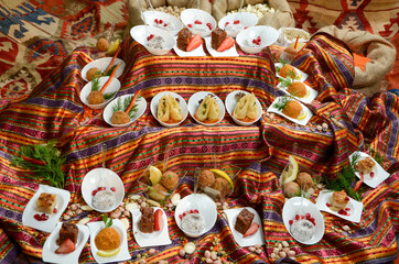 traditional turkish ottoman food in front of legume family sacks