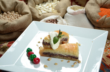 turkish traditional dessert in front of legume family sacks