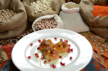 turkish traditional dessert in front of legume family sacks