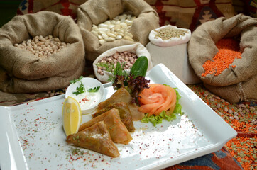 turkish traditional dessert in front of legume family sacks
