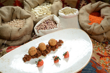 traditional turkish ottoman food in front of legume family sacks
