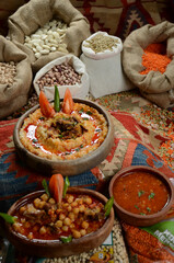 traditional turkish ottoman food in front of legume family sacks