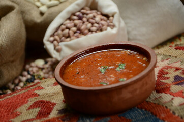 traditional turkish cuisine soup in front of legume family sacks