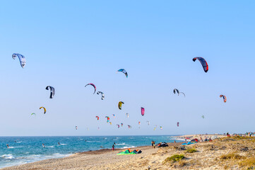 Island of Lefkada, Greece. August 20th, 2011. People doing Kite-Surf and Wind-Surf in a windy day at Milos Beach.