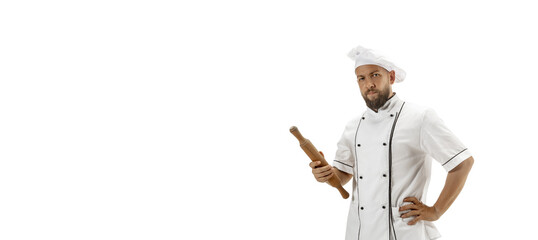 Cooker, chef, baker in uniform isolated on white background. Young man, restaurant cooker's portrait. Business, foor, professional occupation, emotions concept. Copyspace for ad. Flyer, offer.