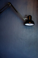 lamp on on dark blue wall background