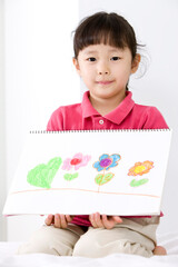 girl showing a drawing