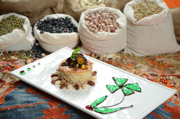 traditional dessert in front of legume family sacks