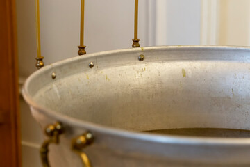 Font with water for the baptism of children in the Orthodox Church. Close-up.