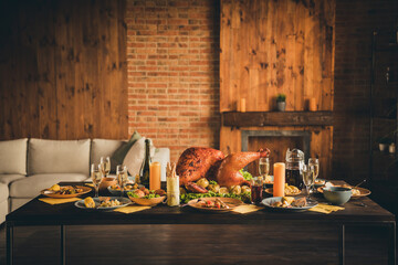 Photo of big baked roast stuffed turkey salad fruit decor canadian family left dinner plates...