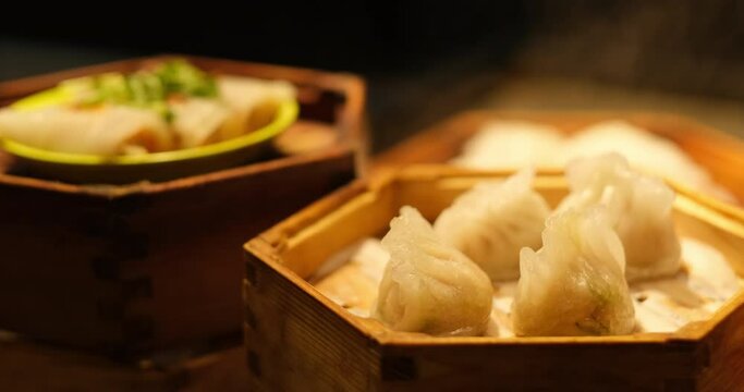 close up steamed pyramid dumplings in steamer. Traditional Chinese snack.