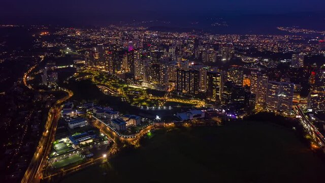 Aerial night hyperlapse city skyline La Mexicana park and lights at dusk
