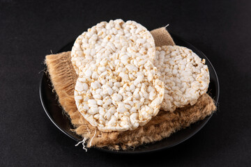 Puffed rice cakes on black stone