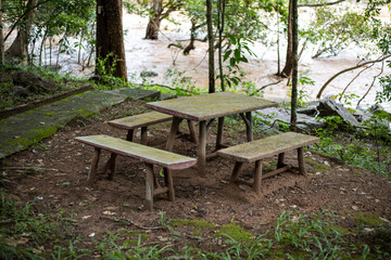 Empty old table at riverside in the outdoor park.
