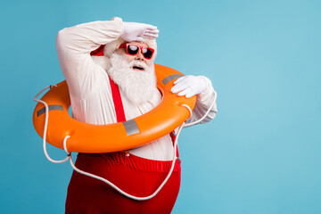 Portrait of his he attractive cheerful cheery dreamy white-haired Santa swimmer sailor wearing safe...