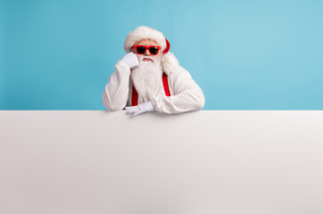 Portrait of his he nice attractive bored sad white-haired Santa presenting copy space board advice...