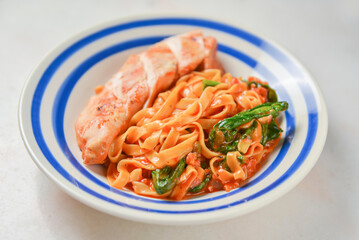 Plate of penne pasta with cheese and meat. Healthy and delicious dinner.