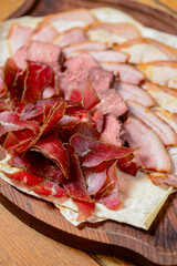 Obraz premium Georgian meat with garlic. Georgian food, Georgian dishes. Traditional cuisine concept. Different kinds of meat.