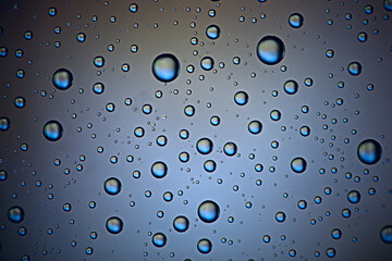 gray wet background / raindrops to overlay on the window, weather, background drops of water rain on the glass transparent