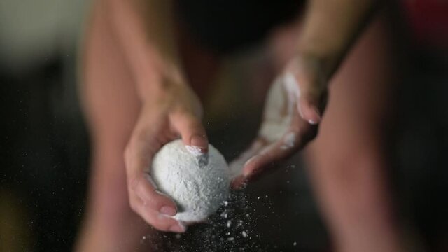 girl putting magnesium powder in a gym