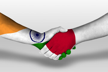 Handshake between japan and india flags painted on hands, illustration with clipping path.