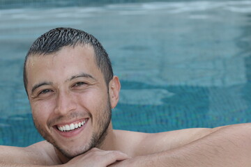 Ethnic man relaxing in swimming pool 