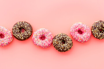 Top view of colorful glazed donut swith sprinkles, copy space