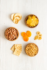 Fototapeta na wymiar Fast food snacks collection - nuts and dried fruits top view